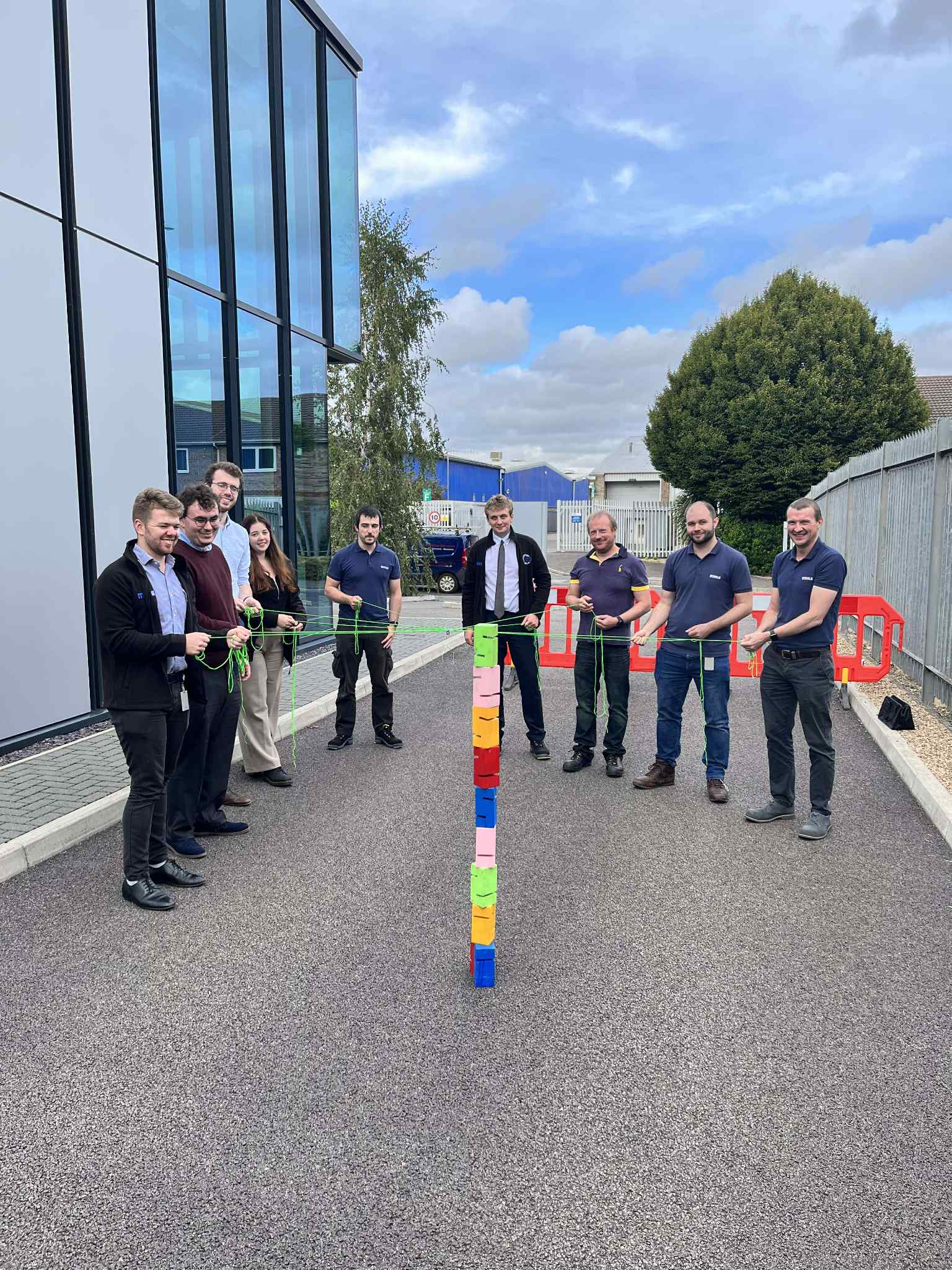 Industrial shift supervisor coaching operator during production process